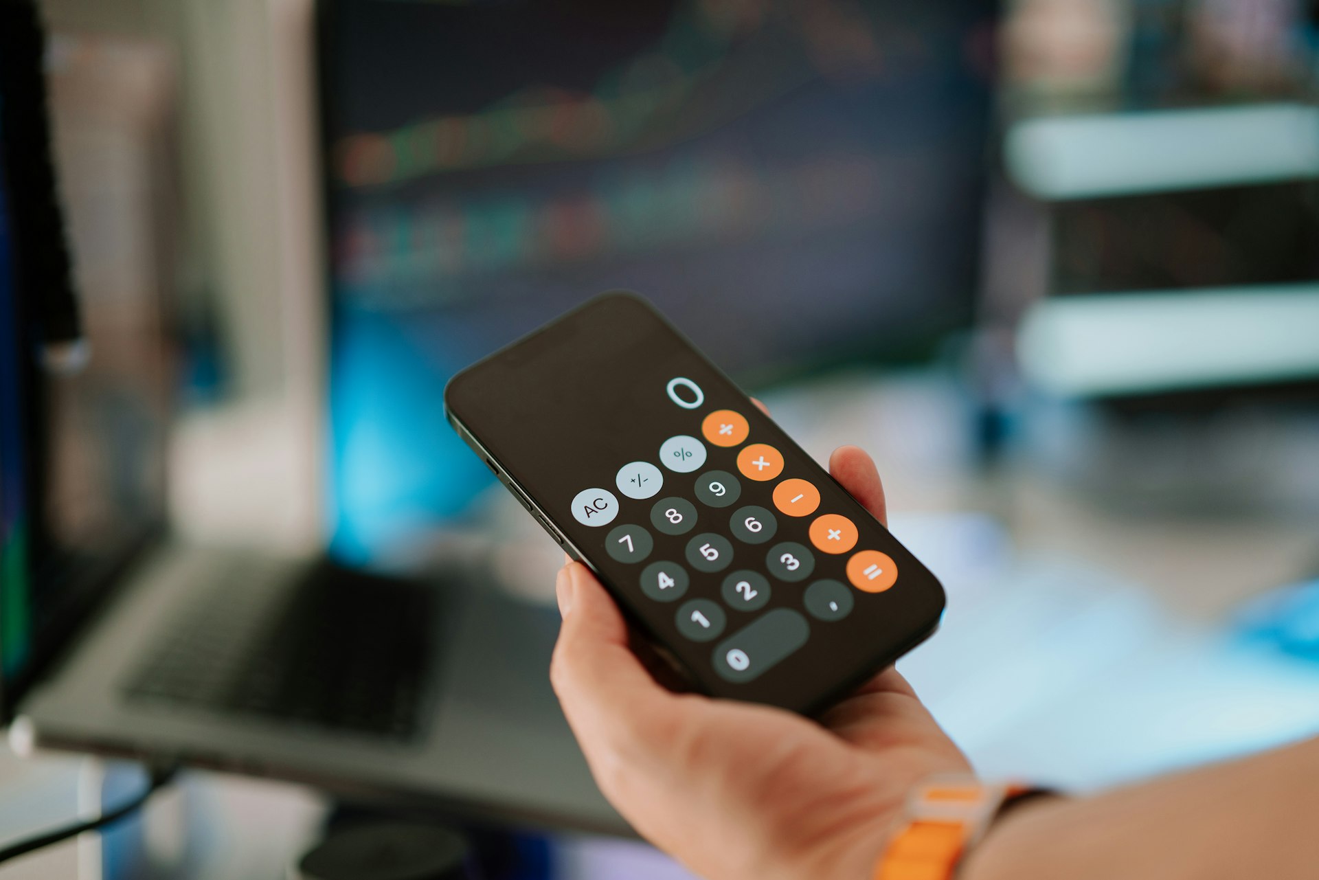 A person holding a remote control in their hand